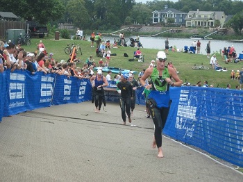 Swimmers exit Savannah River in Augusta, Georgia during Ironman 70.3 Augusta